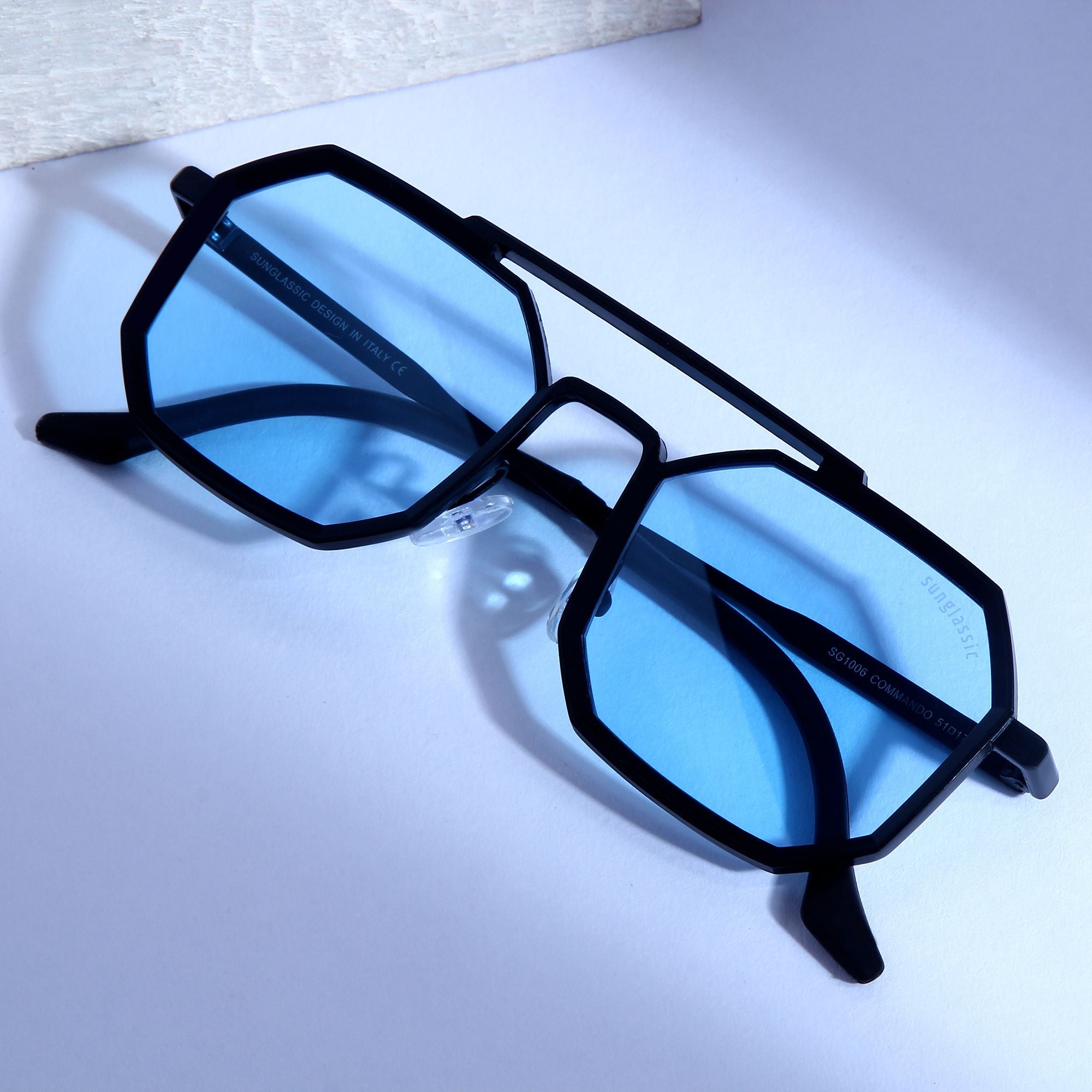 Commando Black Blue Edition Octagon Sunglasses by Sunglassic. Stylish sunglasses with a black frame and blue lenses.