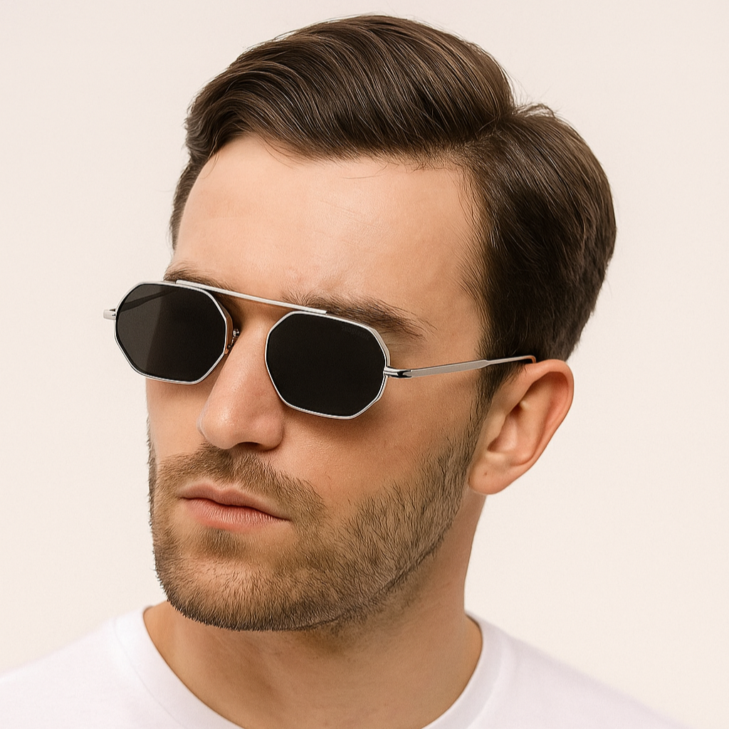 Man wearing sunglasses with a plain background
