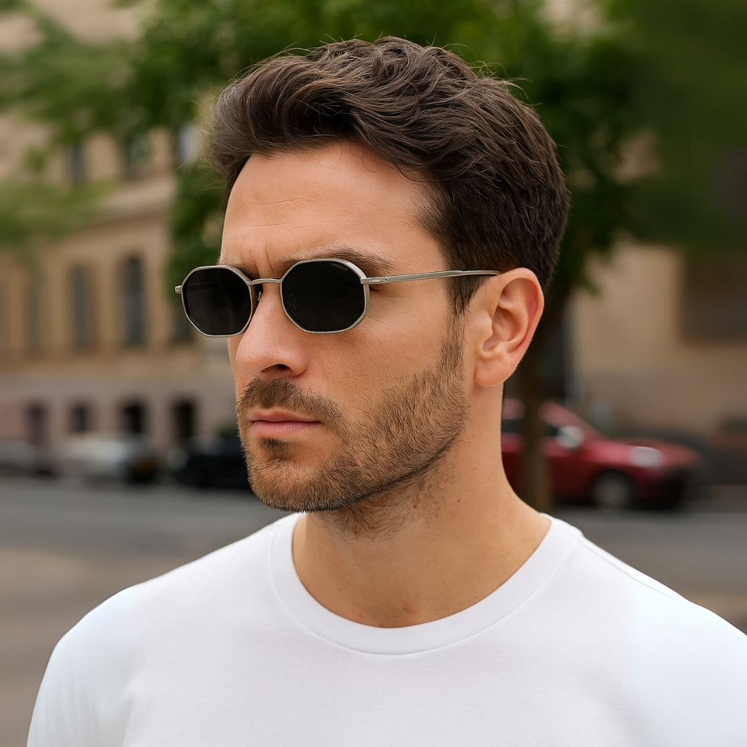 Man wearing sunglasses with a blurred street background