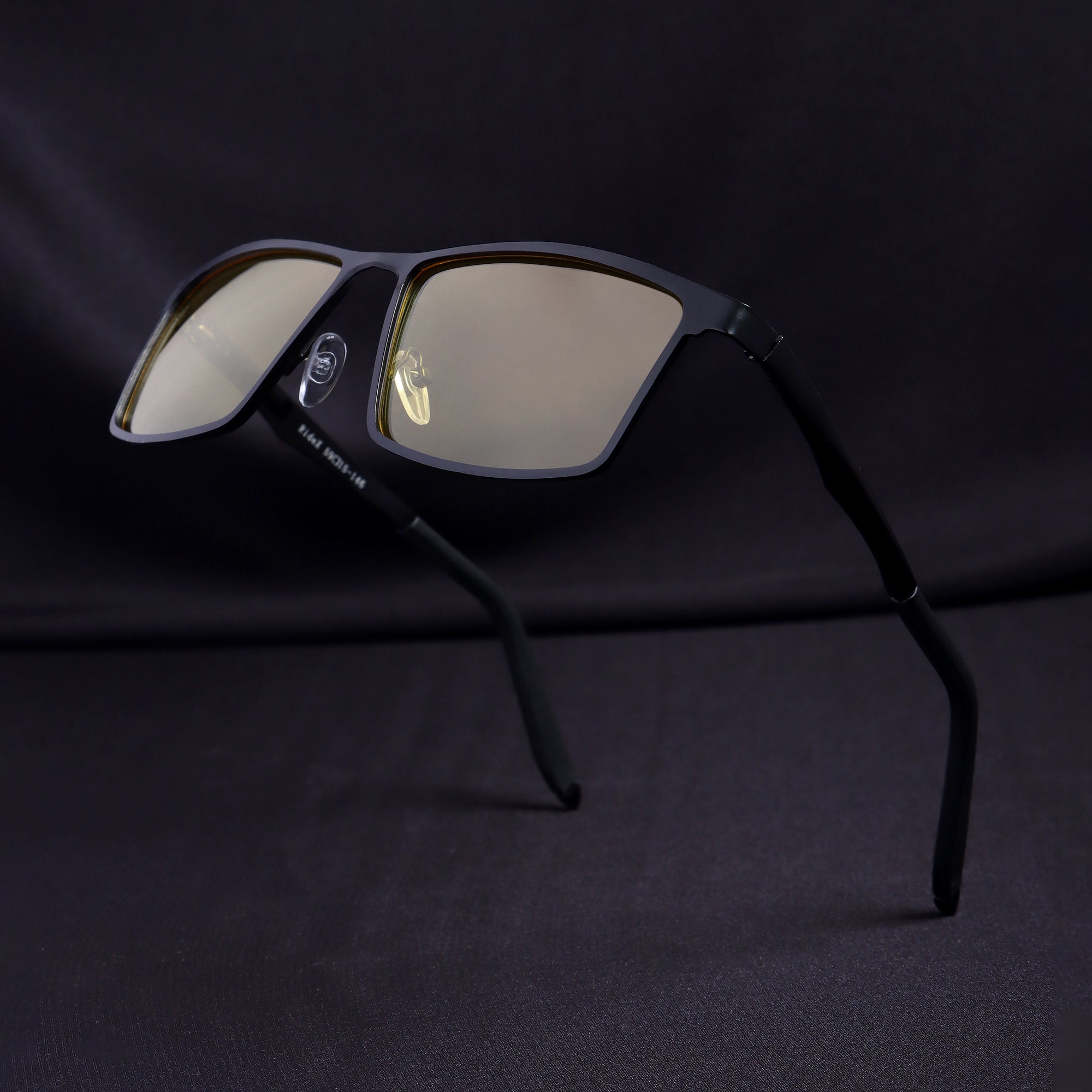 RideX sunglasses in floating angle view showing temple and lens detail