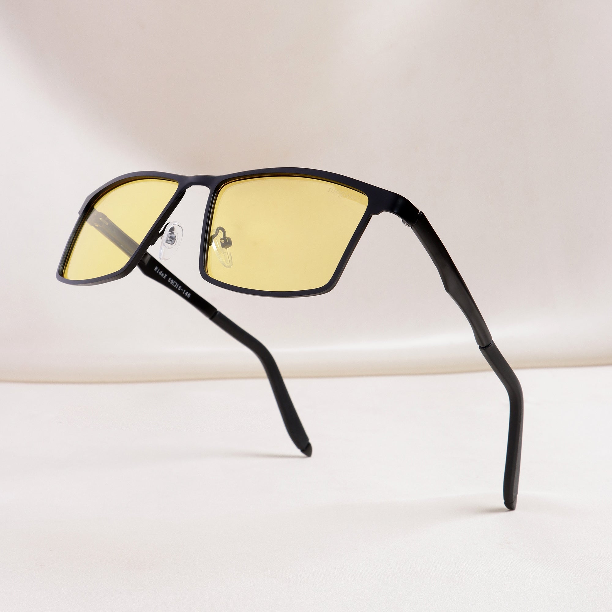 RideX rectangle sunglasses floating on white background with shadow