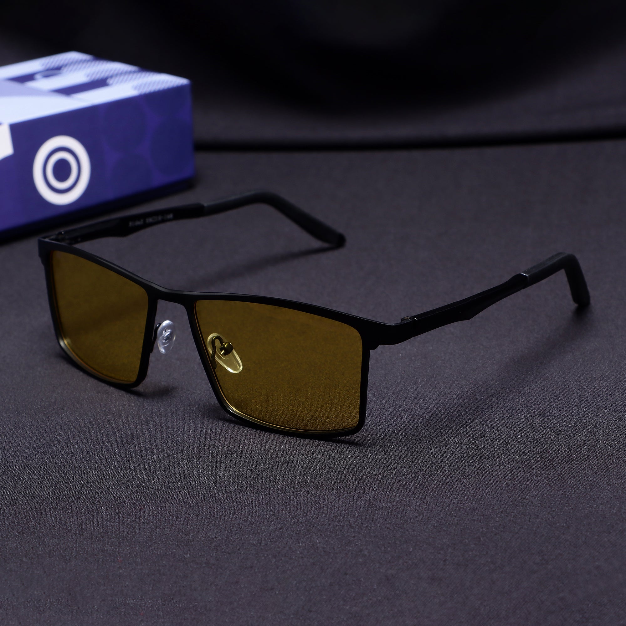 RideX black yellow rectangle sunglasses front view on dark background