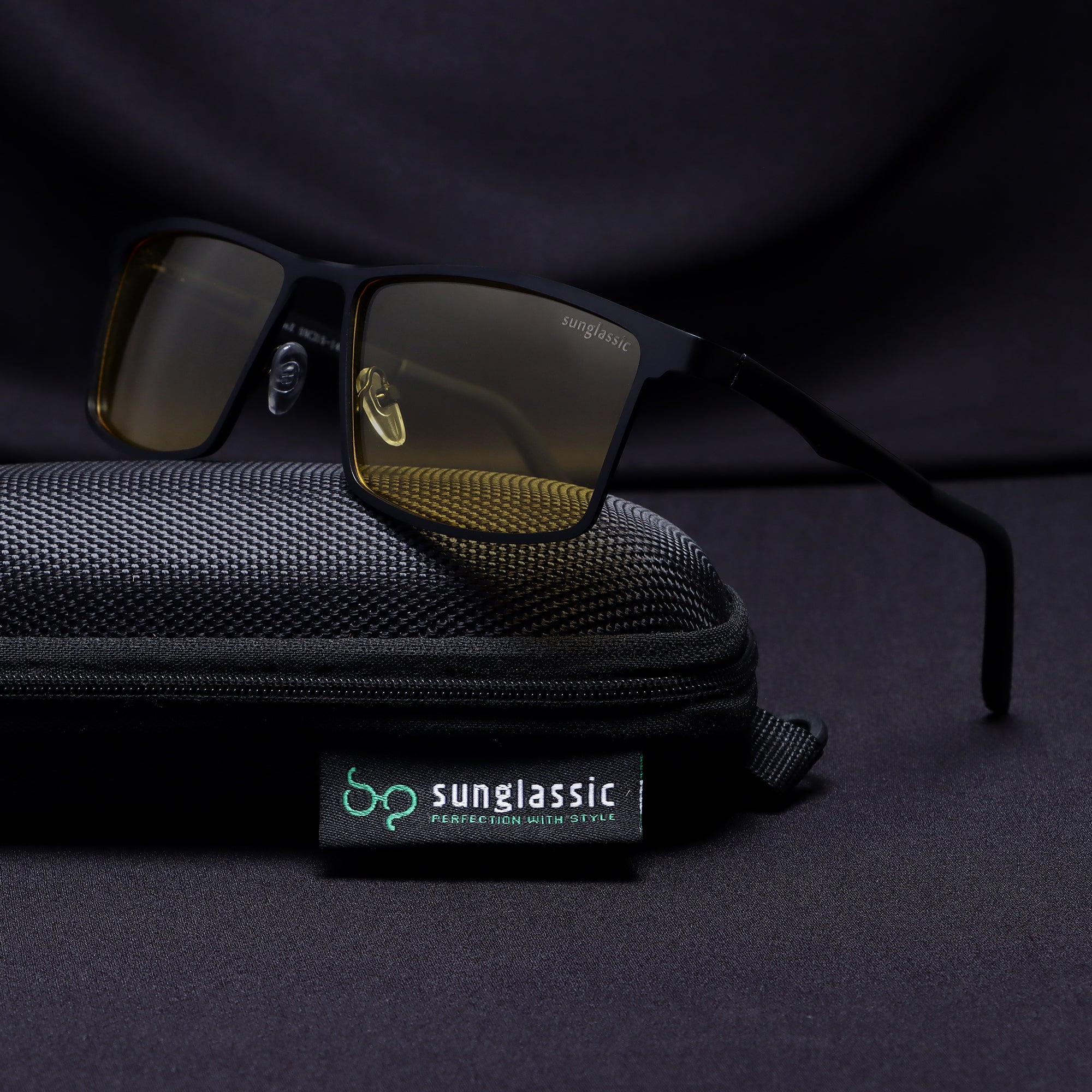 RideX sunglasses resting on Sunglassic black pouch with brand tag