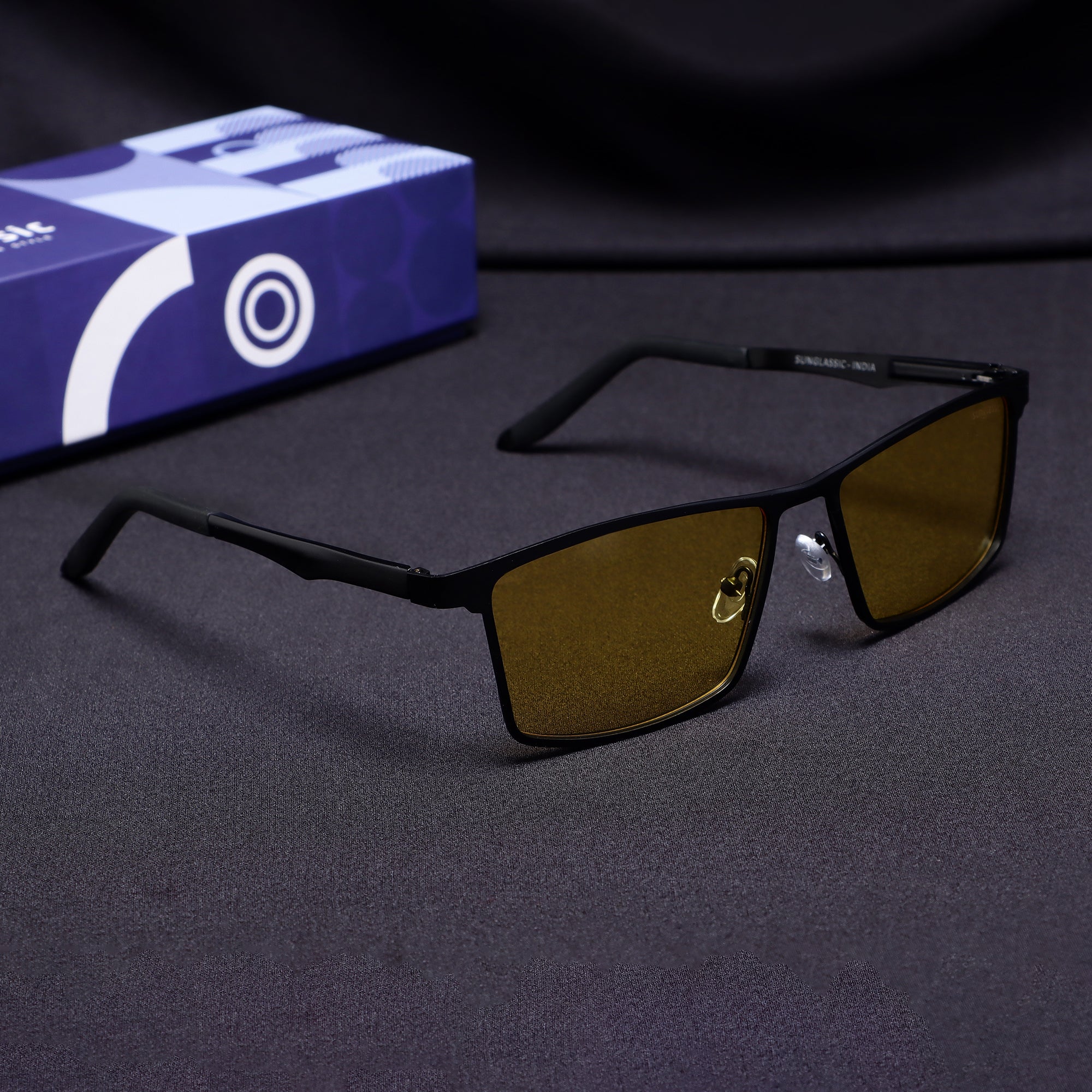 Side angle of RideX black metal frame sunglasses with yellow polarized lens