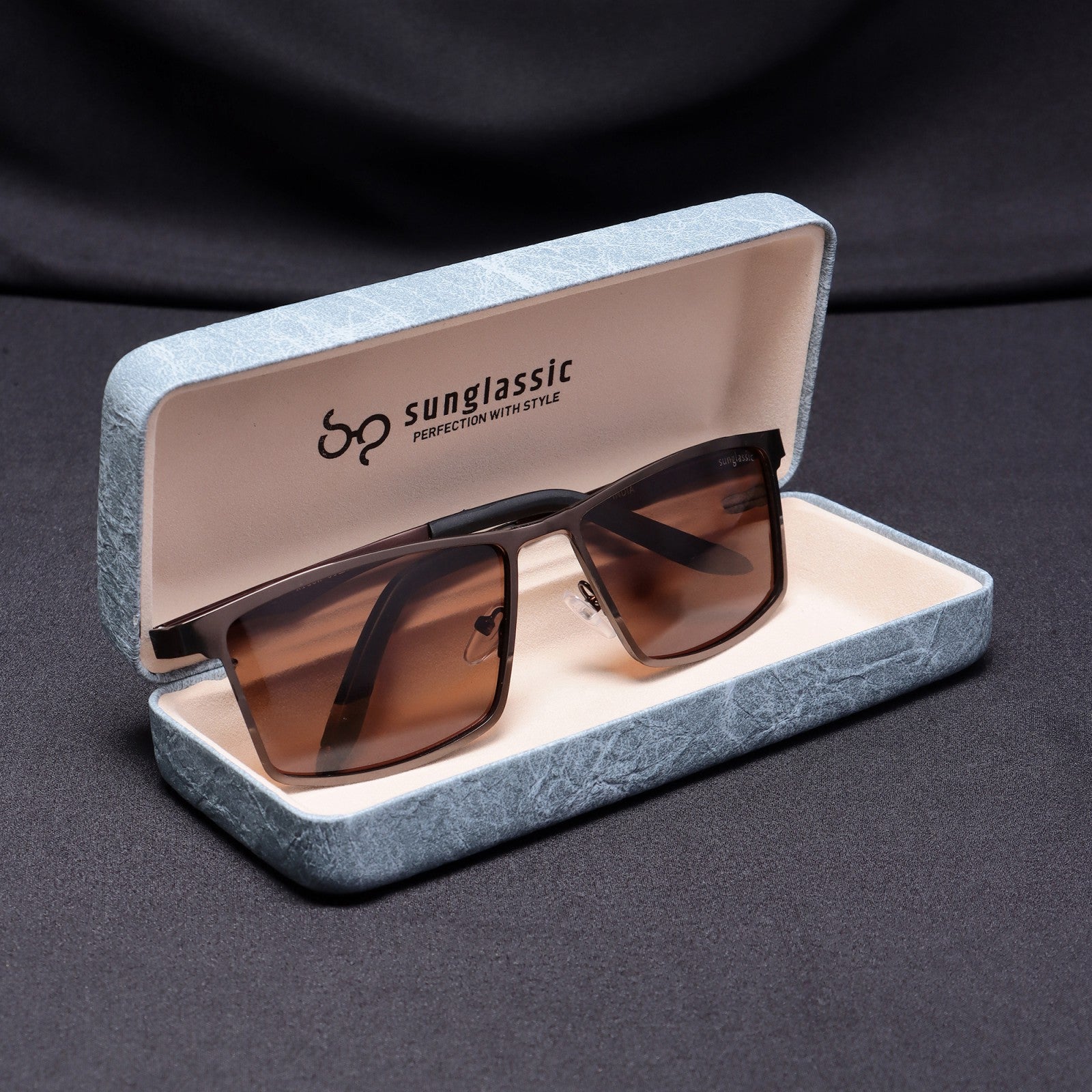 RideX brown sunglasses inside Sunglassic hard case