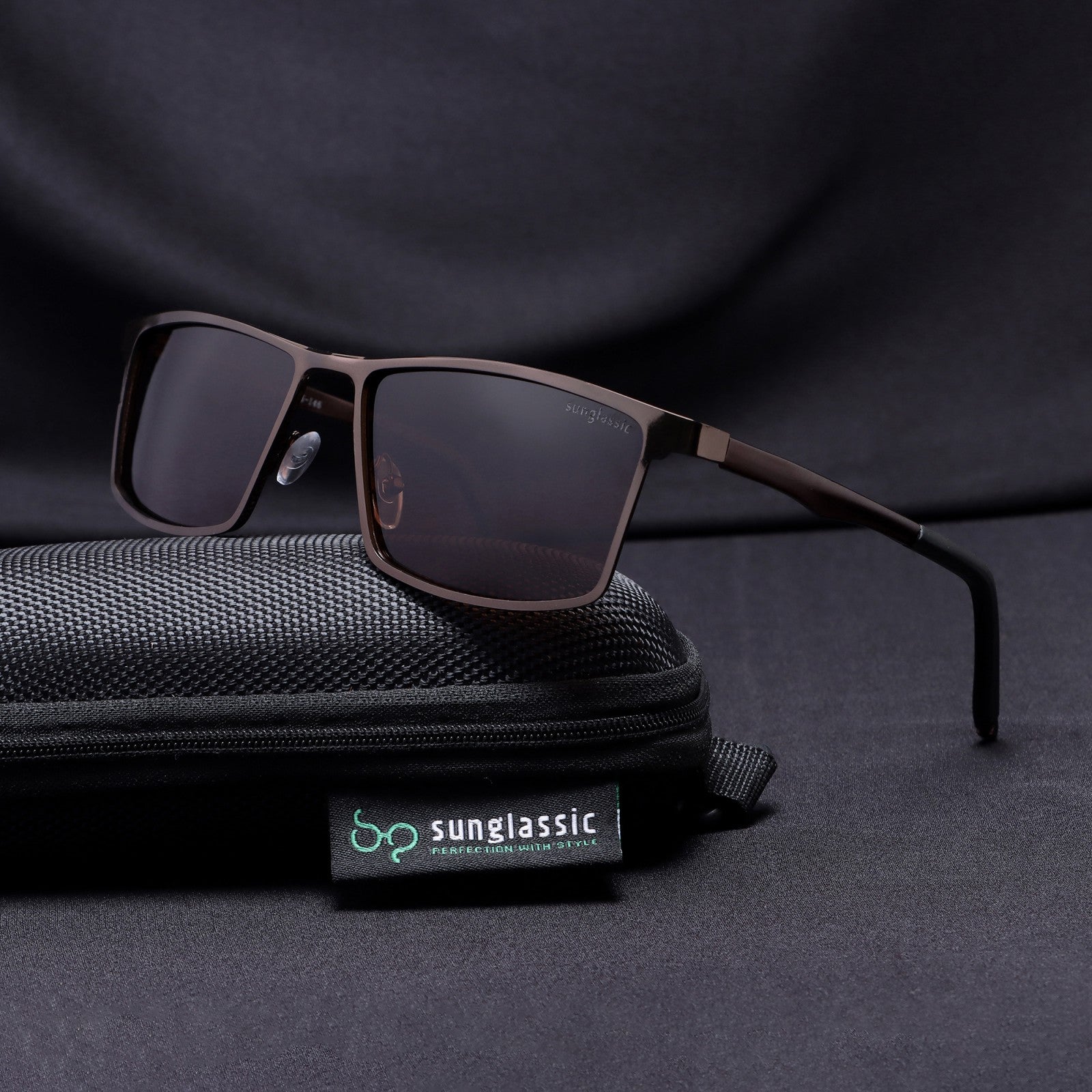 RideX sunglasses resting on Sunglassic black pouch with brand tag