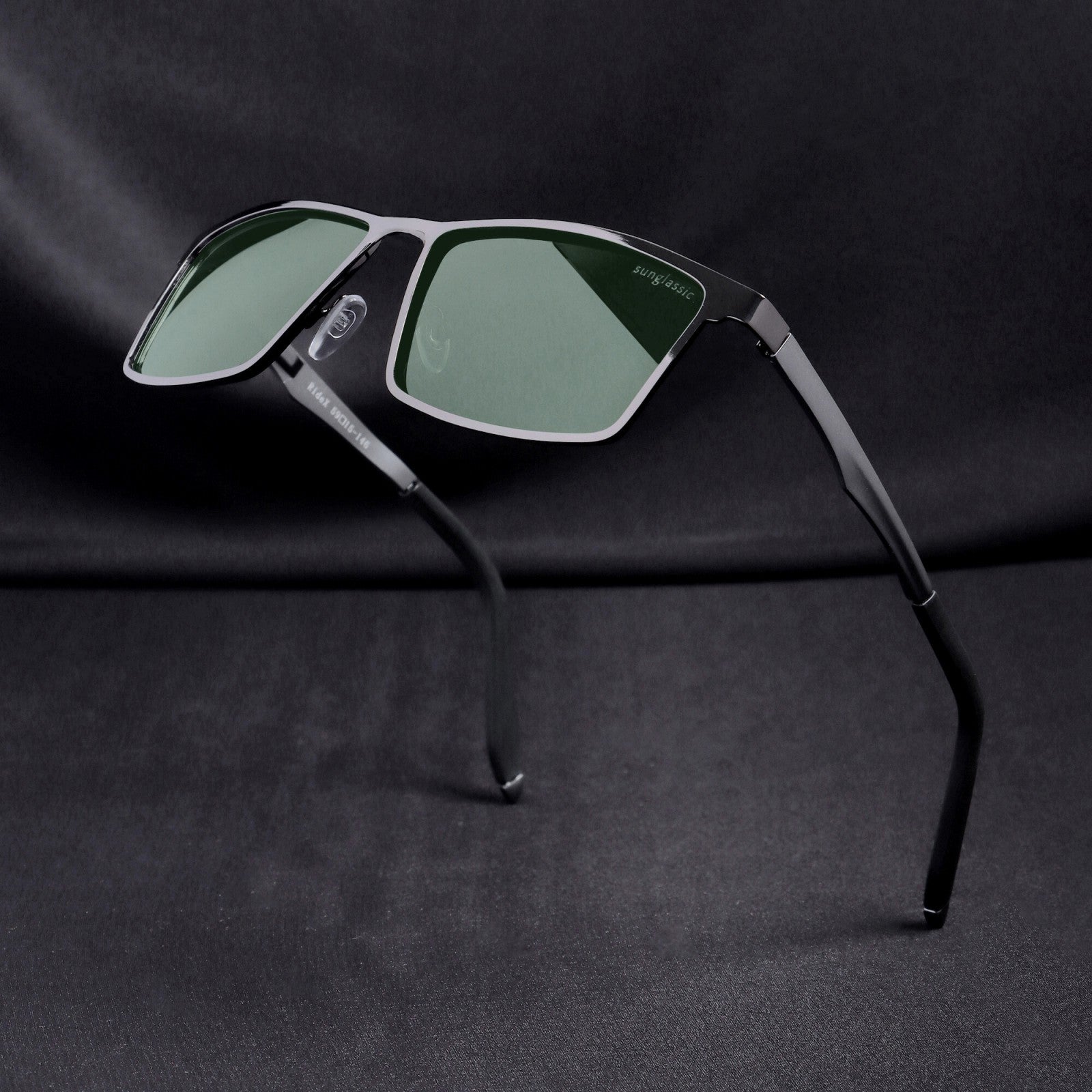 Floating angle view of RideX sunglasses showing lens and hinge detail