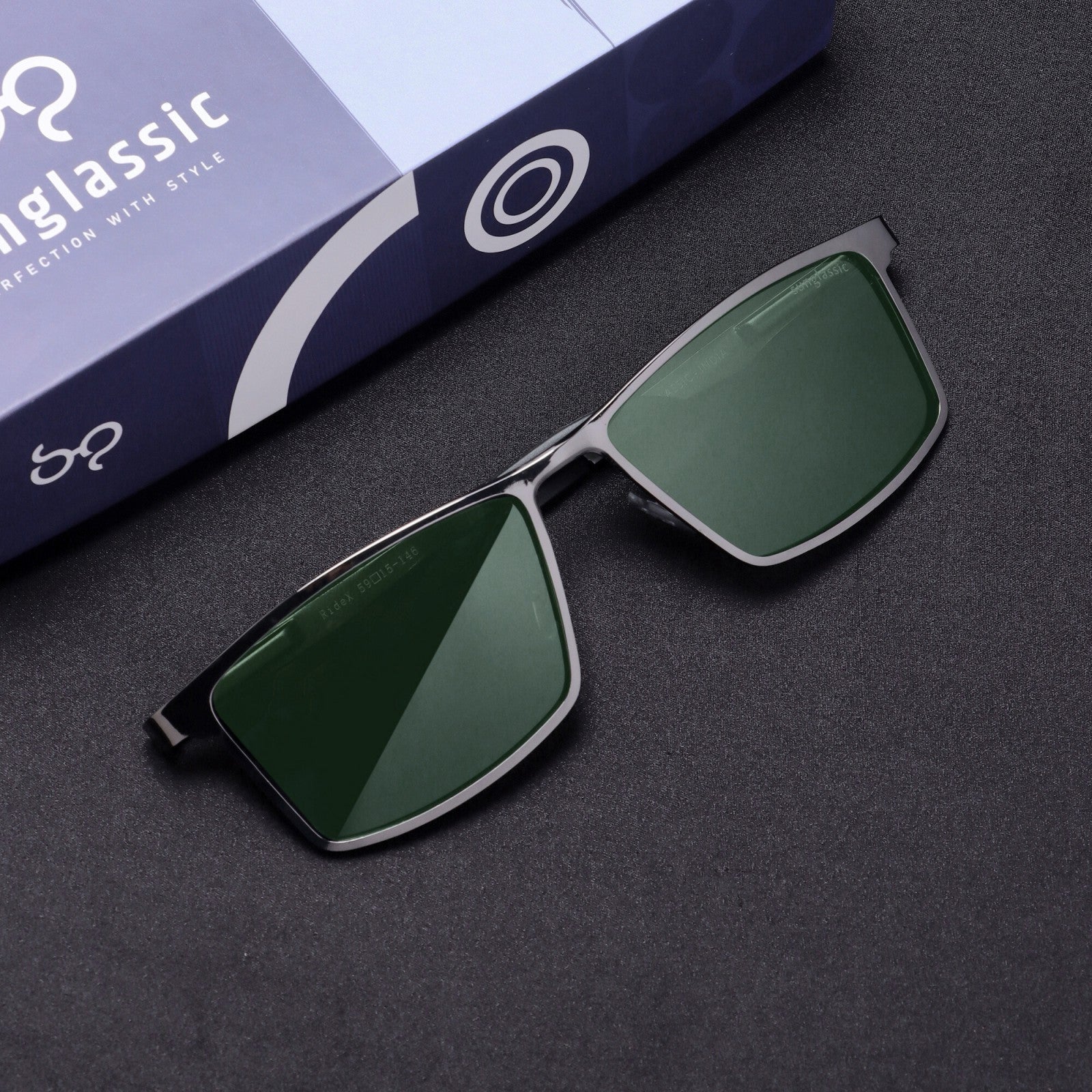 Flat lay top-down of RideX gray green sunglasses with case