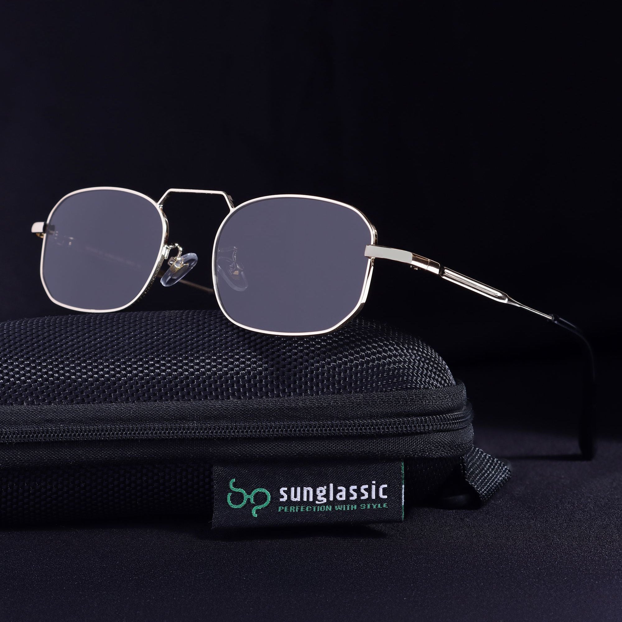 Sunglasses with a black case on a dark background, featuring the Sunglassic brand.