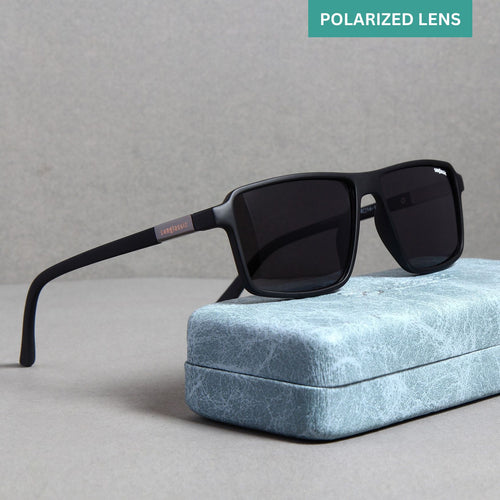 A pair of black polarized rectangle sunglasses with a metallic frame, displayed on a premium metal case.