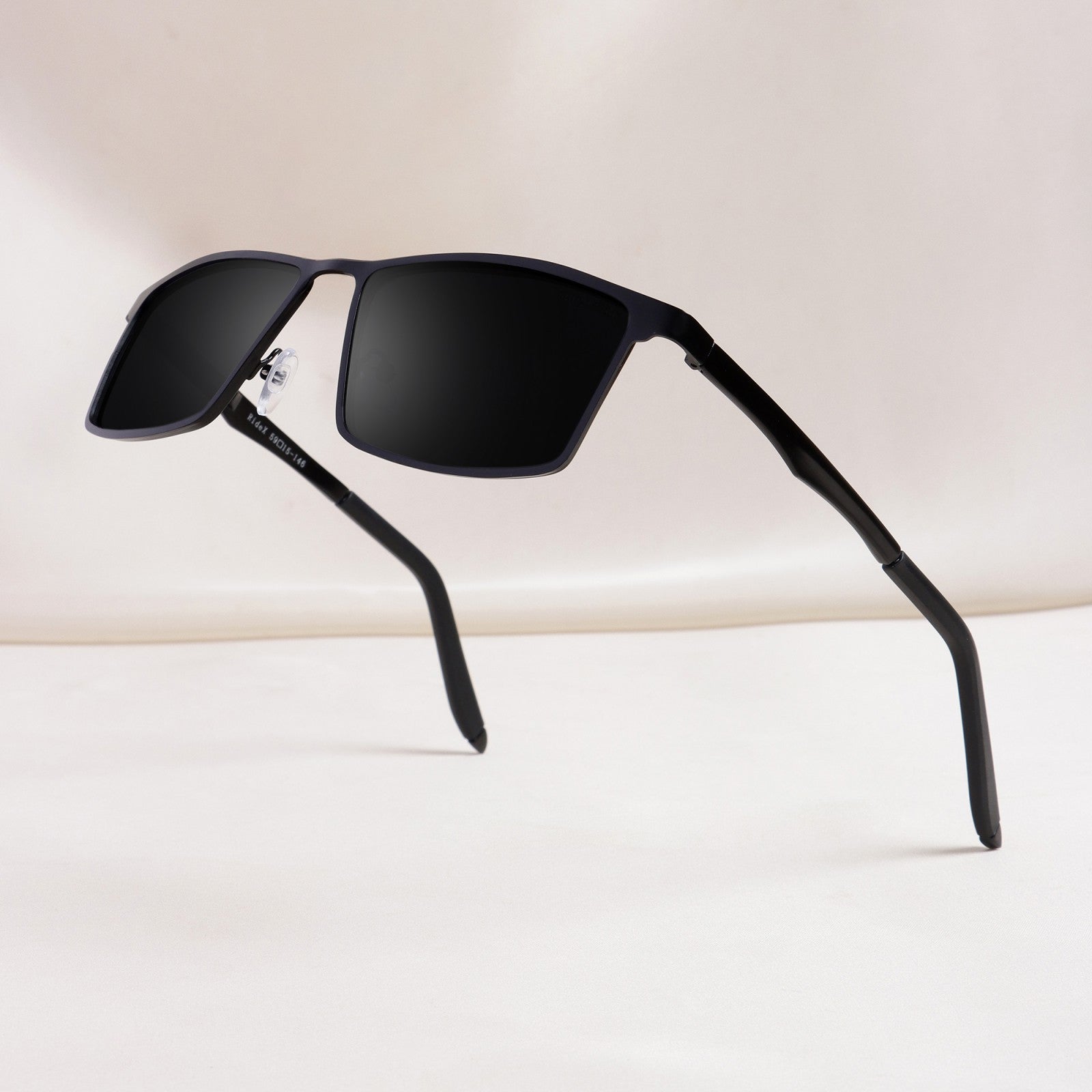 RideX black rectangle sunglasses isolated on white background with shadow
