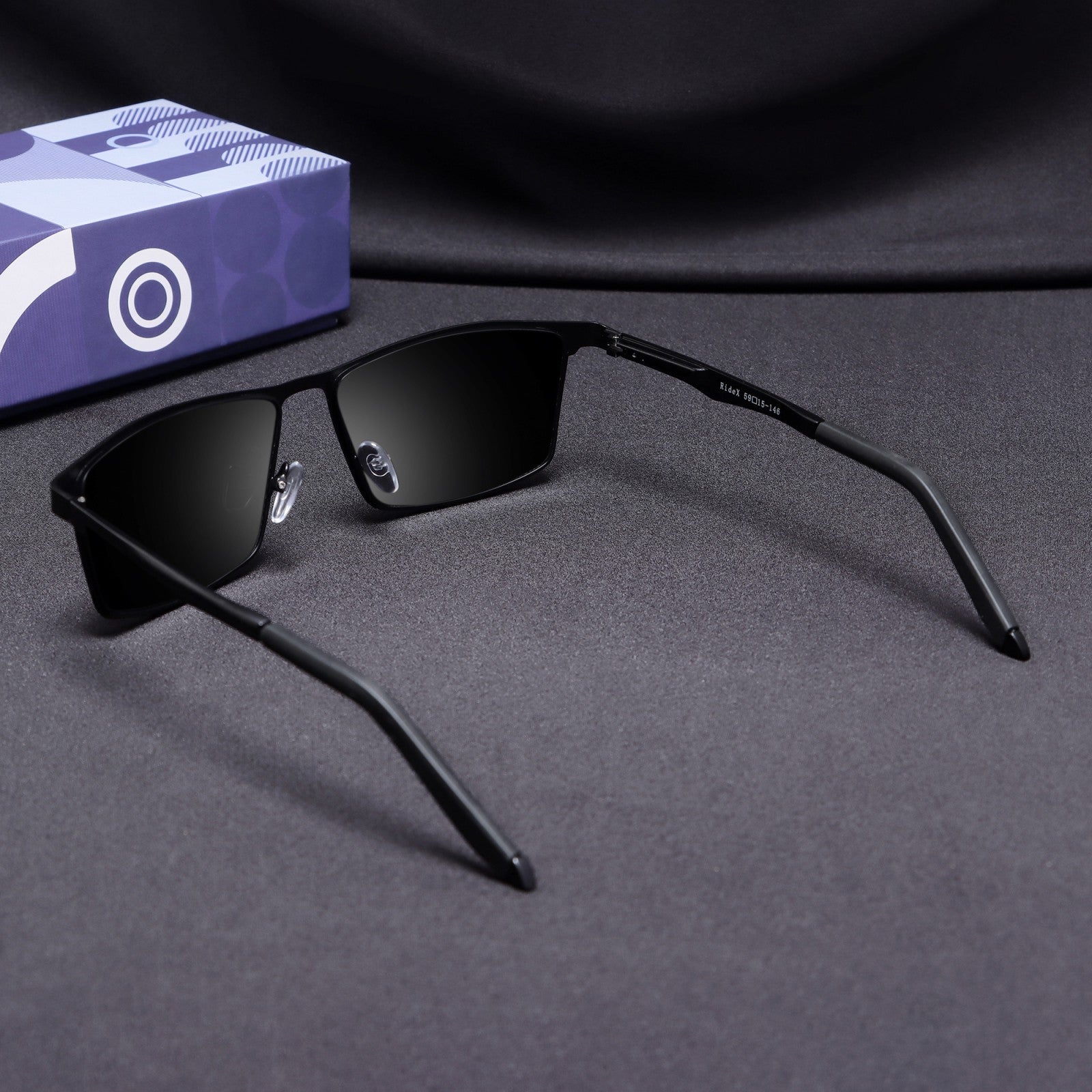 Rear angle of RideX all-black sunglasses showing frame arms and temples
