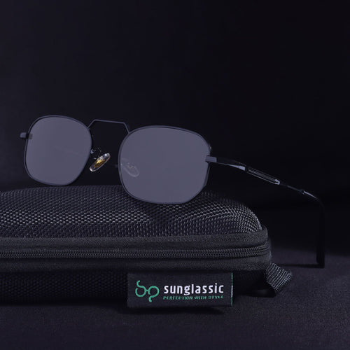 Sunglasses with a black case on a dark background