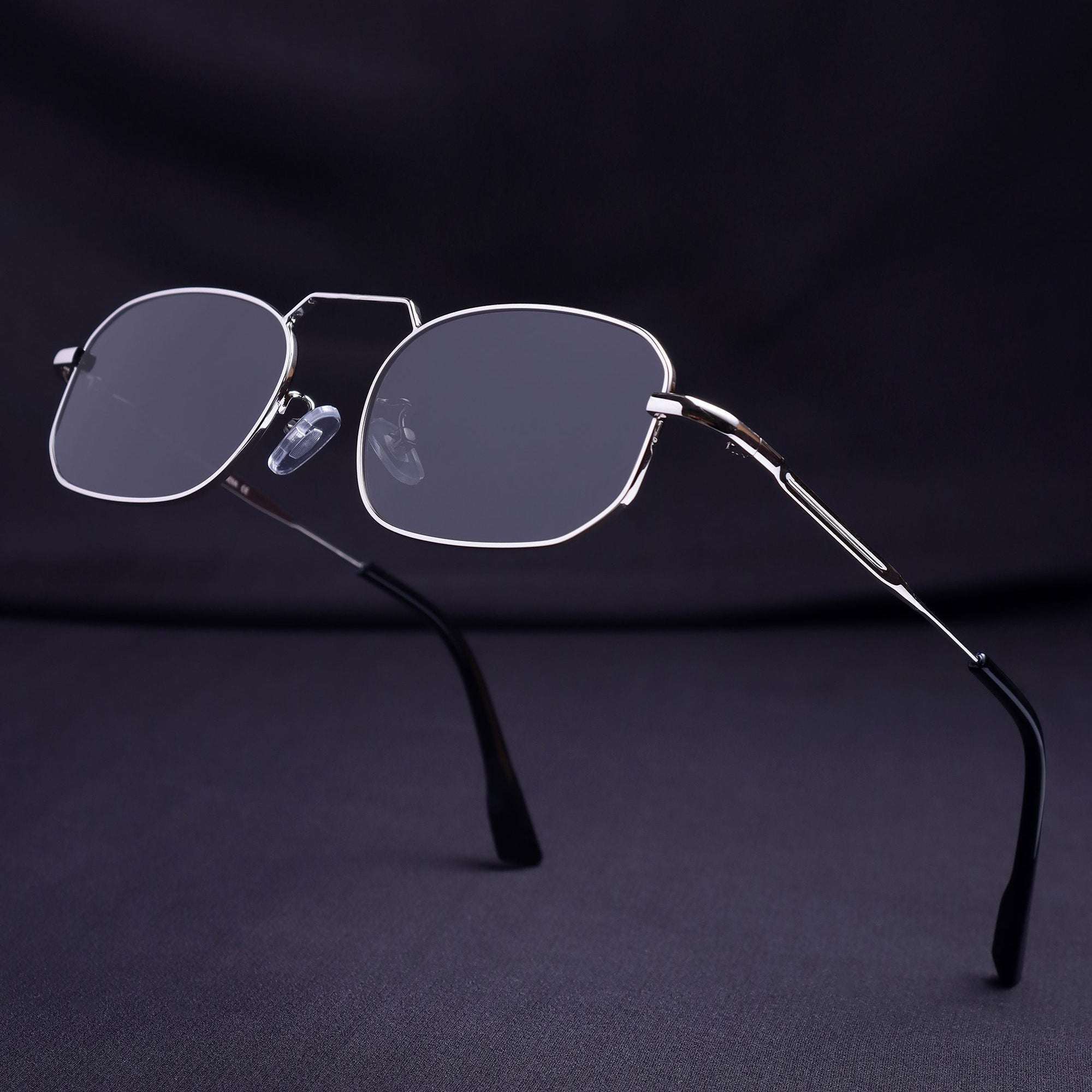 Sunglasses with thin metal frame on a dark background